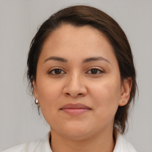 Joyful white young-adult female with medium  brown hair and brown eyes