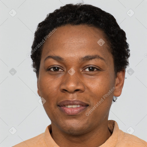 Joyful black adult female with short  black hair and brown eyes
