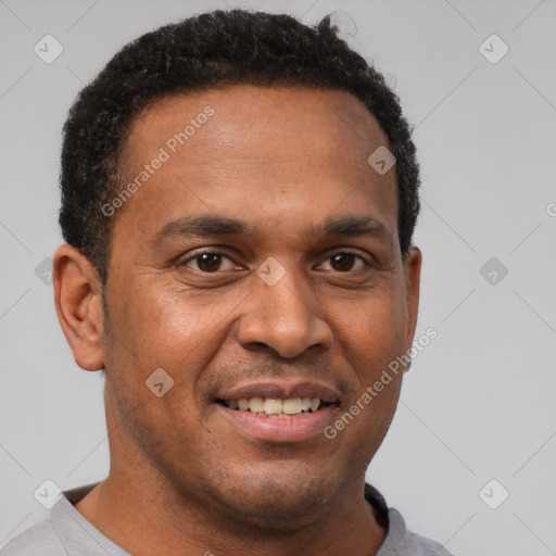 Joyful latino young-adult male with short  brown hair and brown eyes