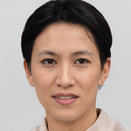 Joyful white young-adult female with short  black hair and brown eyes