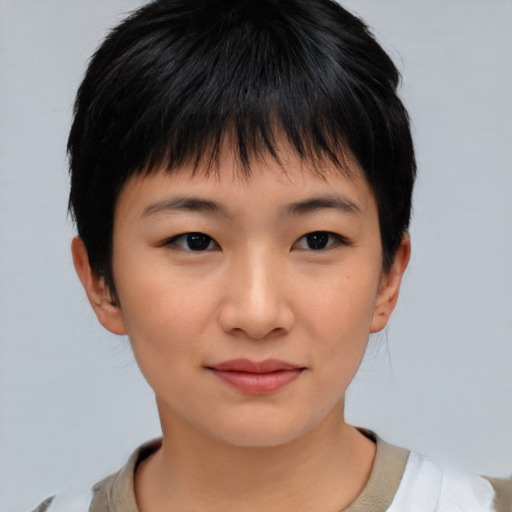 Joyful asian child female with short  brown hair and brown eyes
