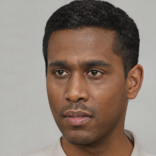 Neutral black young-adult male with short  black hair and brown eyes
