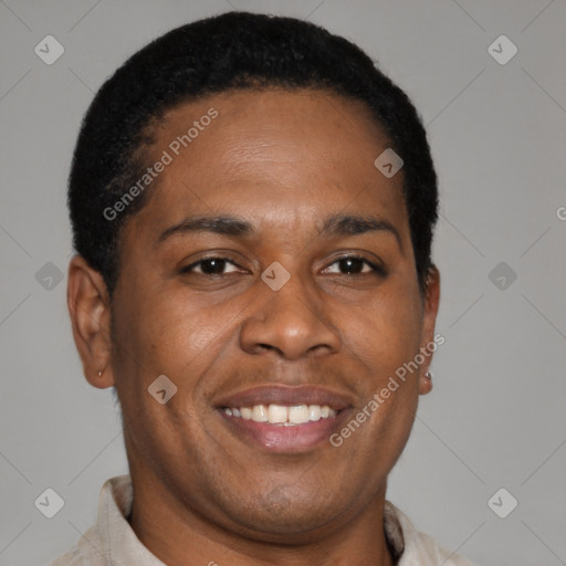 Joyful latino young-adult male with short  brown hair and brown eyes