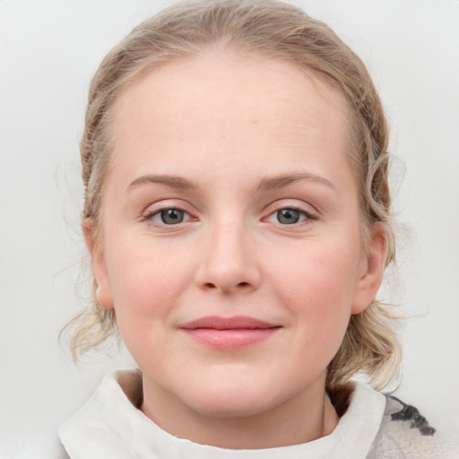 Joyful white child female with medium  brown hair and blue eyes