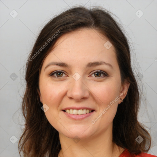 Joyful white young-adult female with long  brown hair and brown eyes