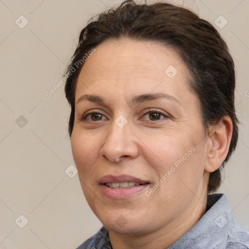 Joyful white adult female with short  brown hair and brown eyes