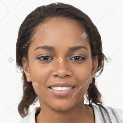 Joyful black young-adult female with long  brown hair and brown eyes