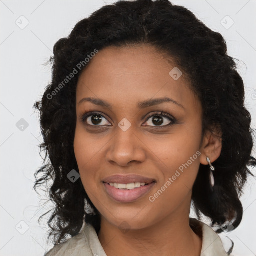 Joyful black young-adult female with long  brown hair and brown eyes