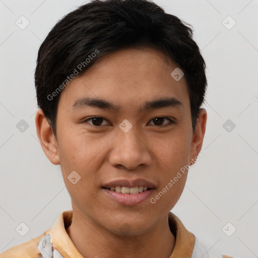 Joyful asian young-adult male with short  brown hair and brown eyes