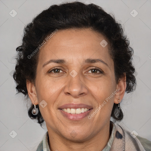 Joyful latino adult female with medium  brown hair and brown eyes