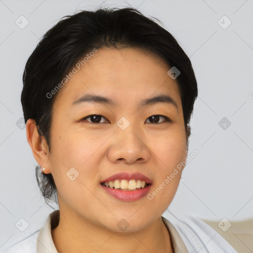 Joyful asian young-adult female with short  brown hair and brown eyes