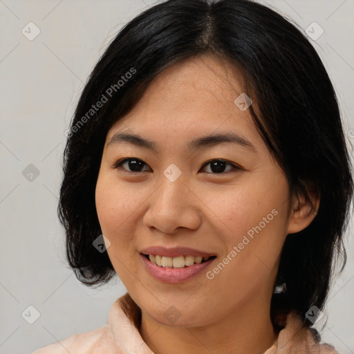 Joyful asian young-adult female with medium  black hair and brown eyes