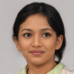 Joyful asian young-adult female with medium  brown hair and brown eyes