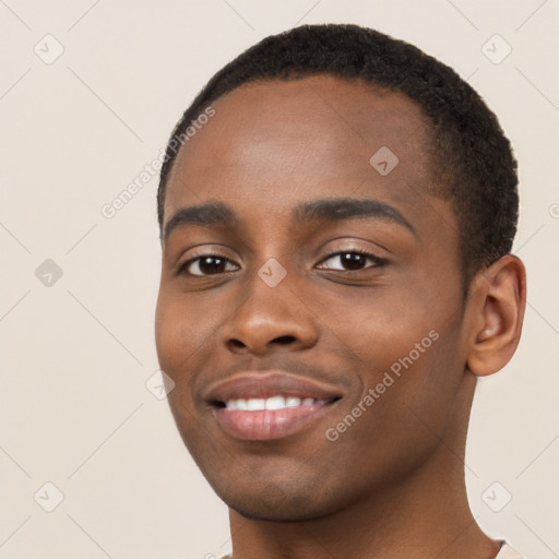 Joyful black young-adult male with short  black hair and brown eyes