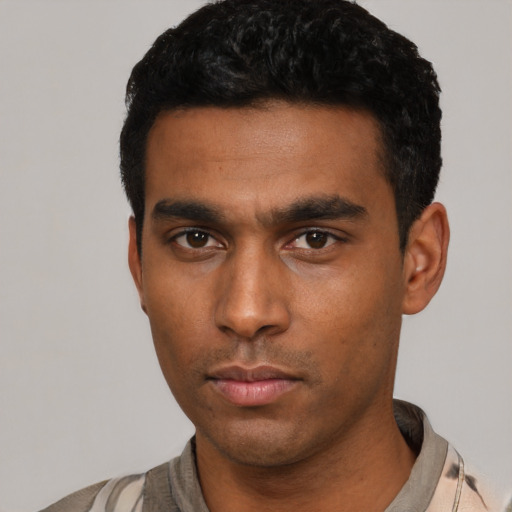 Neutral latino young-adult male with short  black hair and brown eyes