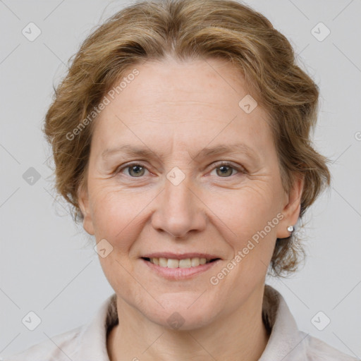 Joyful white adult female with medium  brown hair and grey eyes