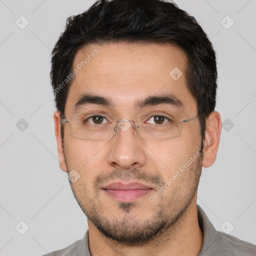 Joyful white young-adult male with short  black hair and brown eyes