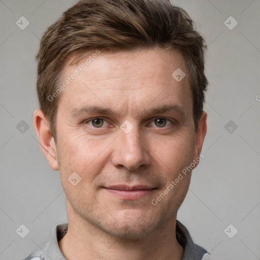 Joyful white adult male with short  brown hair and grey eyes