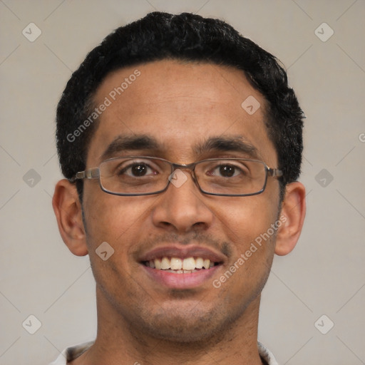 Joyful white adult male with short  black hair and brown eyes