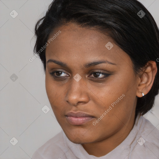 Joyful black young-adult female with medium  brown hair and brown eyes