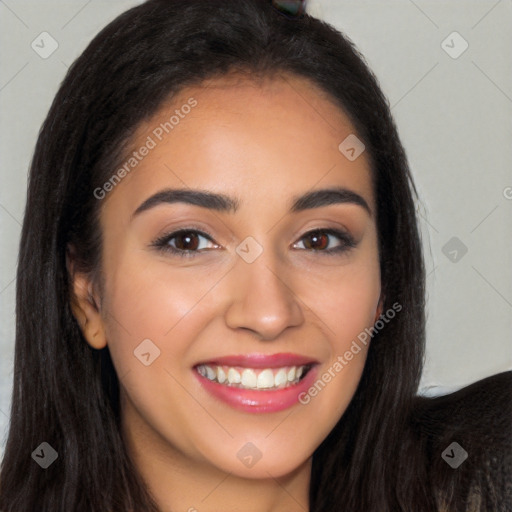 Joyful latino young-adult female with long  brown hair and brown eyes