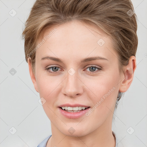 Joyful white young-adult female with short  brown hair and grey eyes