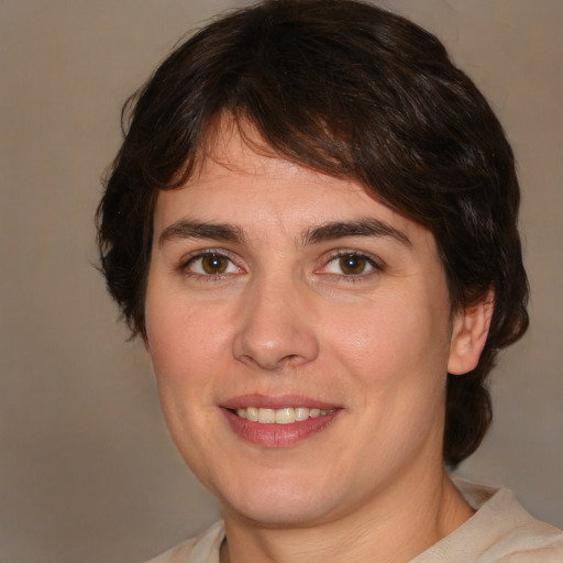 Joyful white young-adult female with medium  brown hair and brown eyes