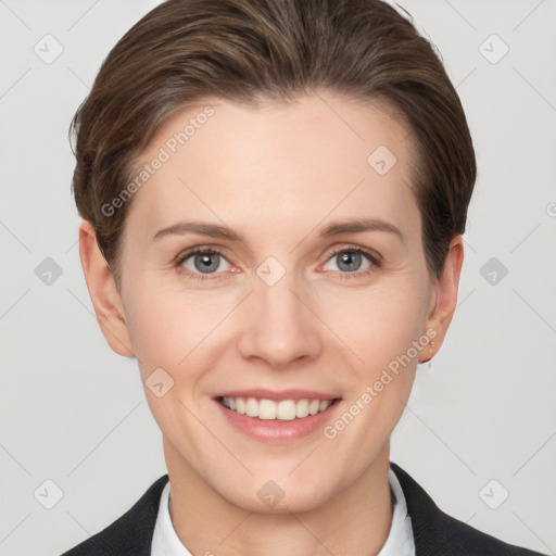 Joyful white young-adult female with short  brown hair and grey eyes