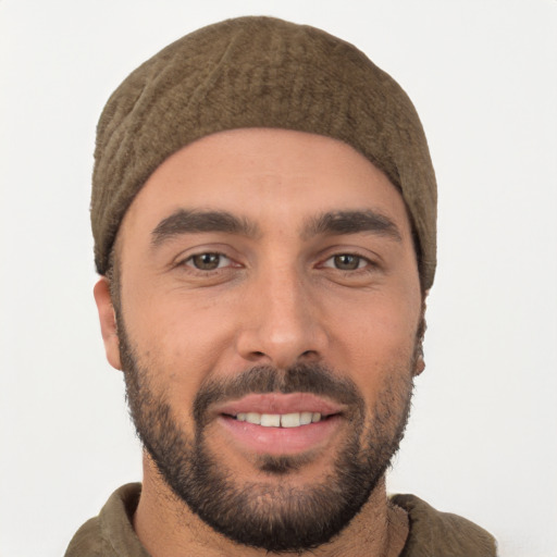 Joyful white young-adult male with short  black hair and brown eyes