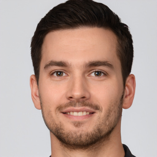 Joyful white young-adult male with short  brown hair and brown eyes