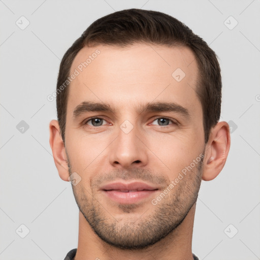 Joyful white young-adult male with short  brown hair and brown eyes