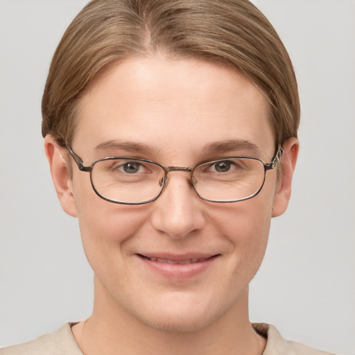 Joyful white adult female with short  brown hair and grey eyes