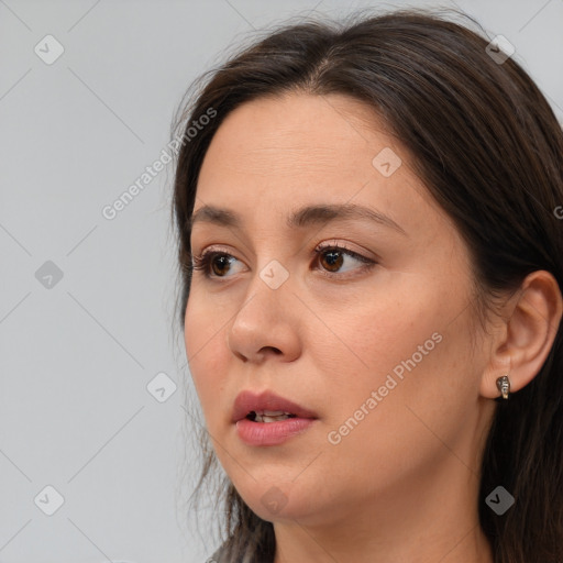 Neutral white young-adult female with long  brown hair and brown eyes