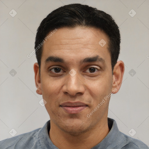 Joyful latino adult male with short  black hair and brown eyes