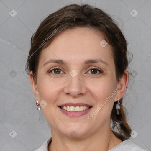 Joyful white adult female with medium  brown hair and grey eyes