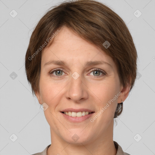 Joyful white adult female with short  brown hair and grey eyes