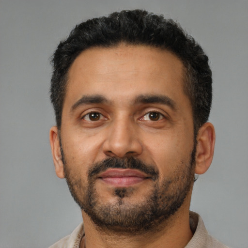 Neutral latino adult male with short  black hair and brown eyes
