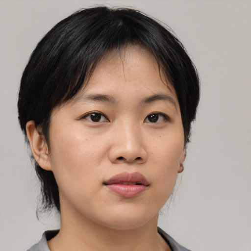 Neutral asian young-adult female with medium  black hair and brown eyes