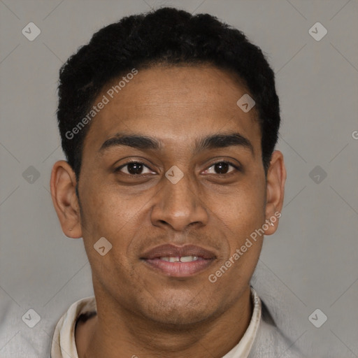 Joyful black young-adult male with short  black hair and brown eyes