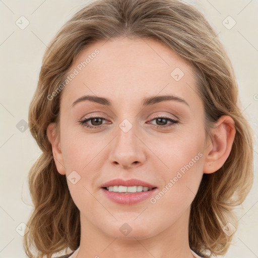 Joyful white young-adult female with medium  brown hair and blue eyes