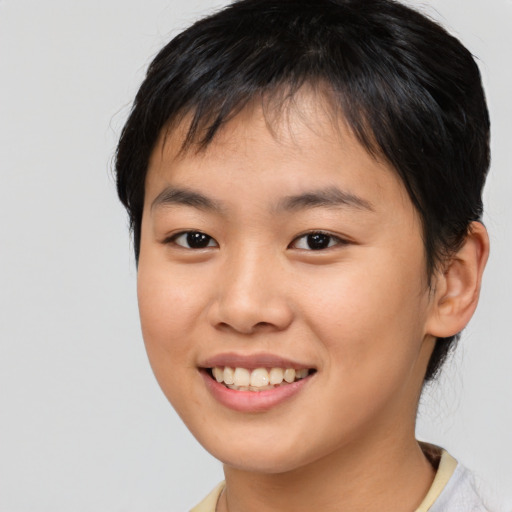 Joyful asian young-adult female with short  brown hair and brown eyes