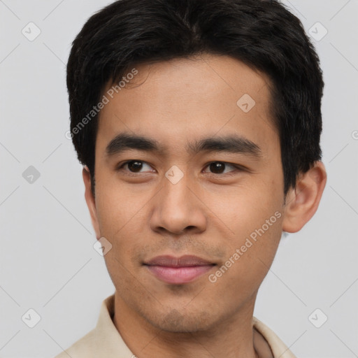 Joyful white young-adult male with short  black hair and brown eyes