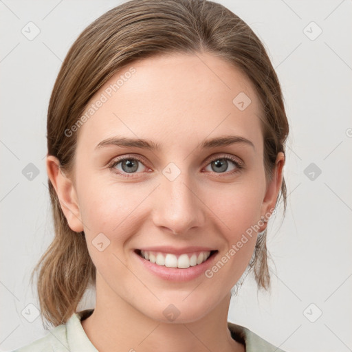 Joyful white young-adult female with medium  brown hair and blue eyes