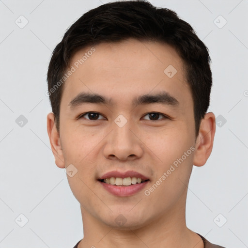 Joyful white young-adult male with short  black hair and brown eyes