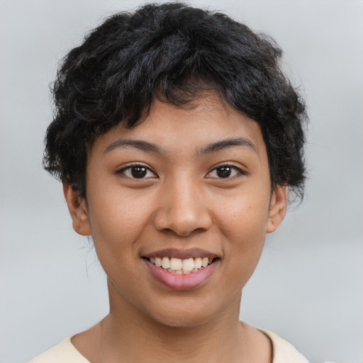 Joyful latino young-adult female with short  brown hair and brown eyes