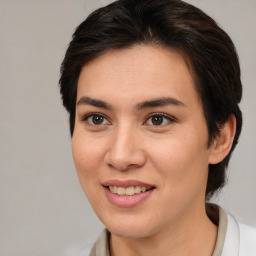 Joyful white young-adult female with medium  brown hair and brown eyes