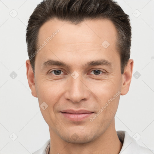 Joyful white young-adult male with short  brown hair and brown eyes