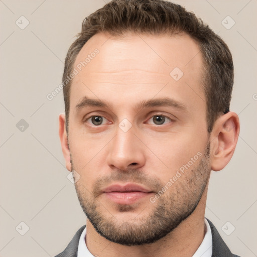 Neutral white young-adult male with short  brown hair and brown eyes