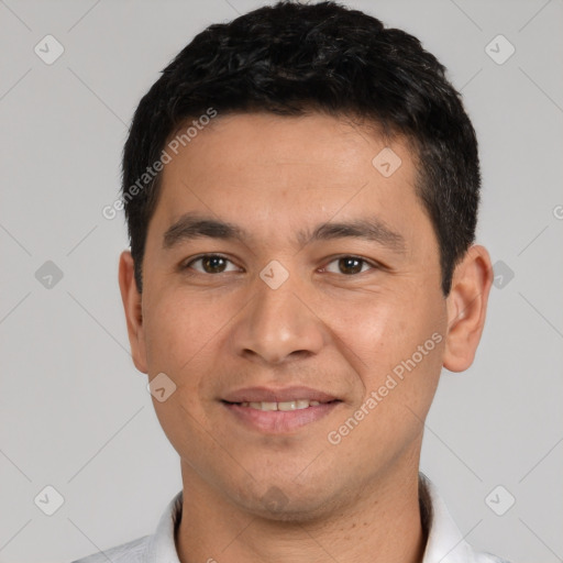 Joyful white young-adult male with short  black hair and brown eyes