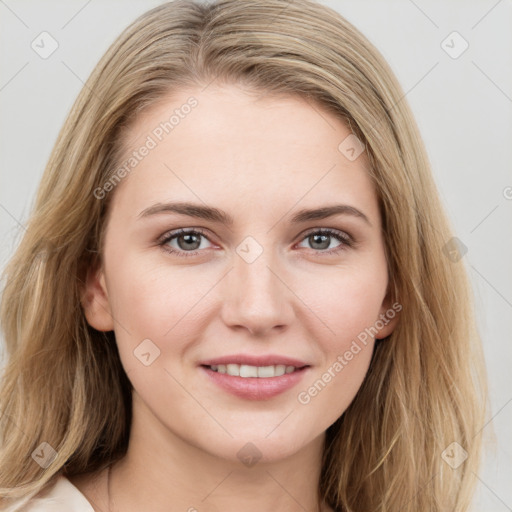 Joyful white young-adult female with long  brown hair and blue eyes